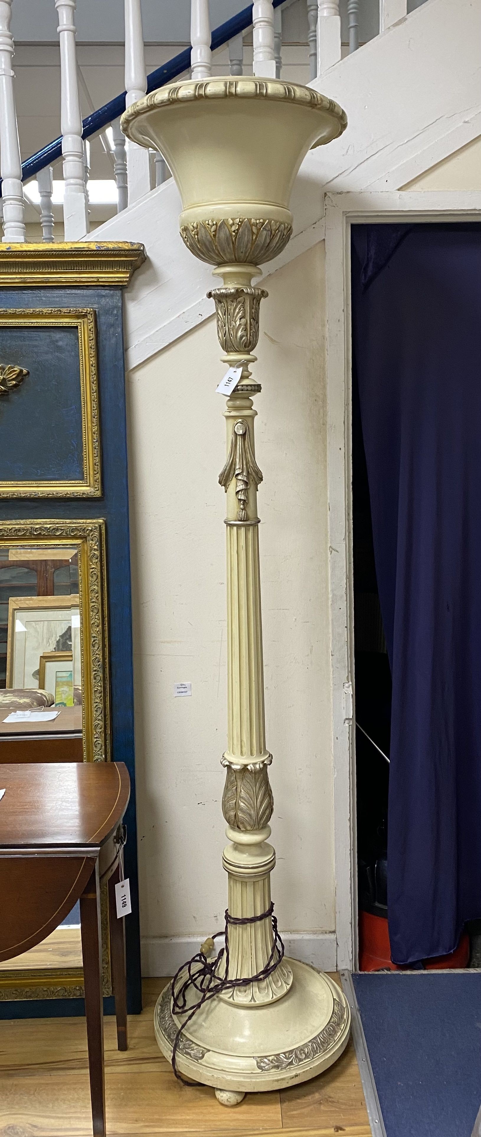 A cream painted part silvered uplighter floor lamp, height 190cm